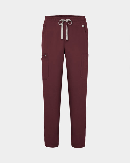 Heme red colored scrub pants with straight legs, cargo pockets, and a logo drawstring.