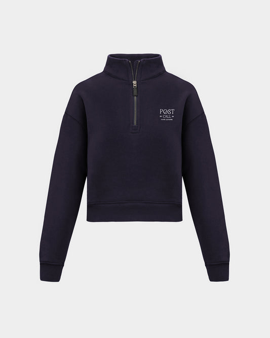 A navy long-sleeve quarter-zip pullover sweatshirt with a small white 'POST CALL' logo on the left chest displayed on a clean light gray background.