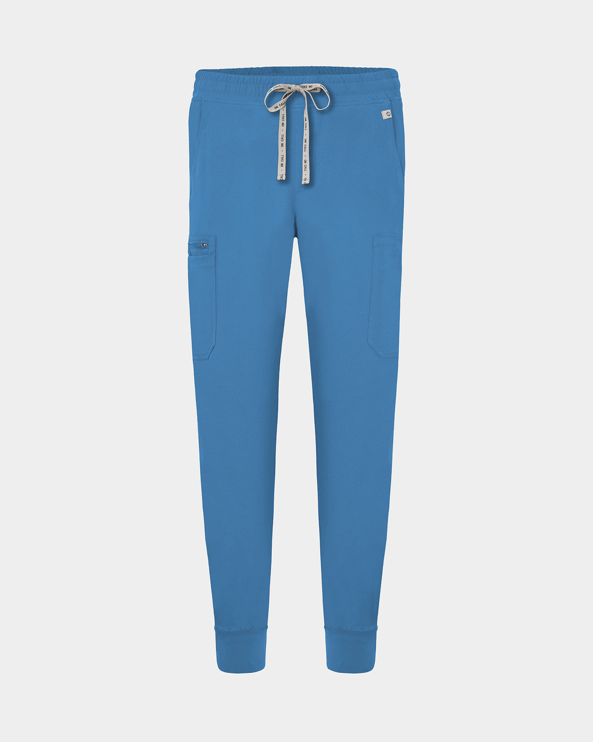 Bright blue scrub pants with a drawstring waist, side cargo pocket, and ribbed ankle cuffs, shown on a light gray background.