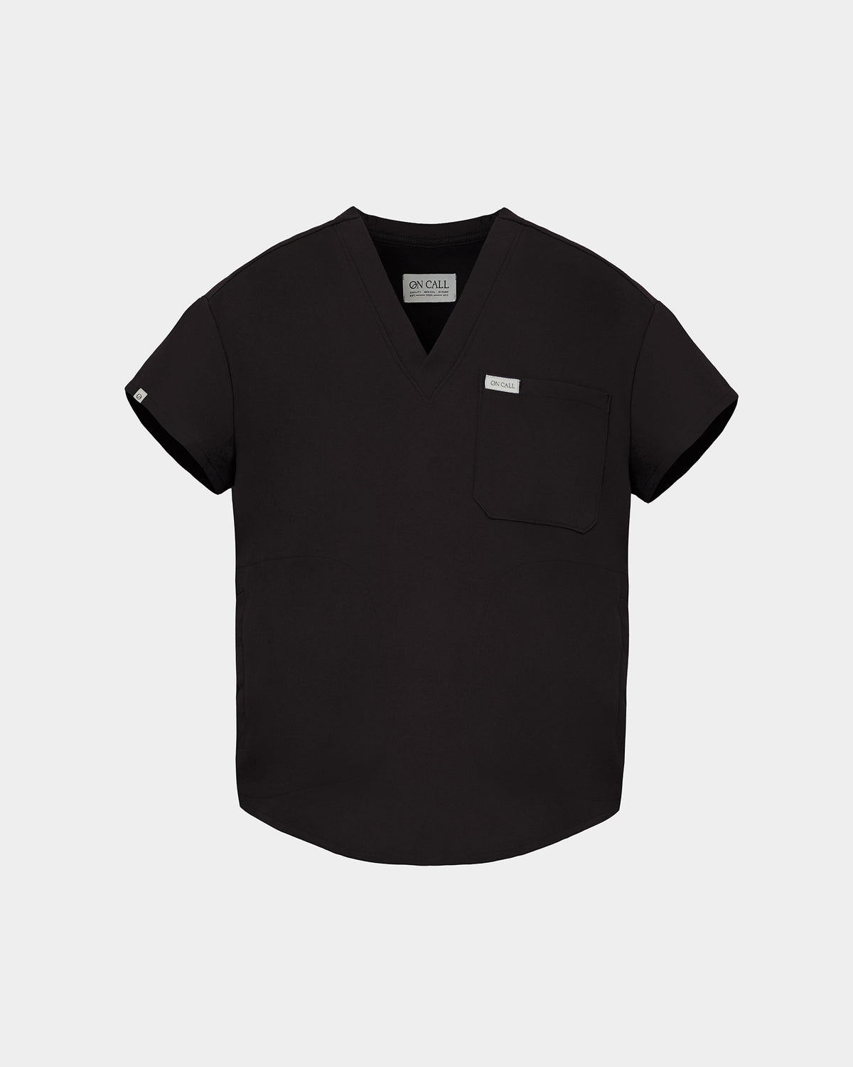 A black short-sleeve V-neck scrub top with a chest pocket and a small white brand tag, displayed on a light gray background.