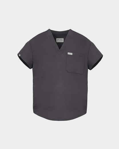 A dark gray V-neck scrub top with short sleeves, a chest pocket, and a small white brand tag on the left chest, displayed against a light gray background.
