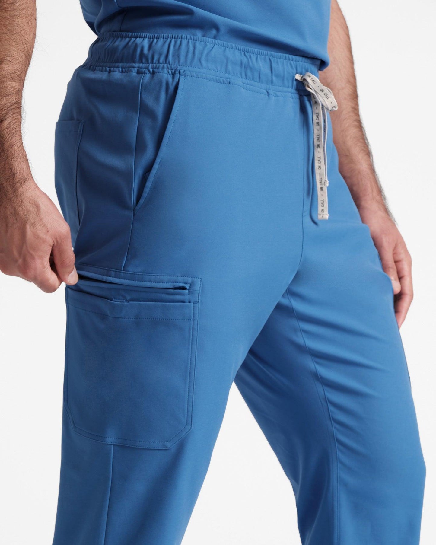 Pocket close up of men's cargo scrub pant in venous blue