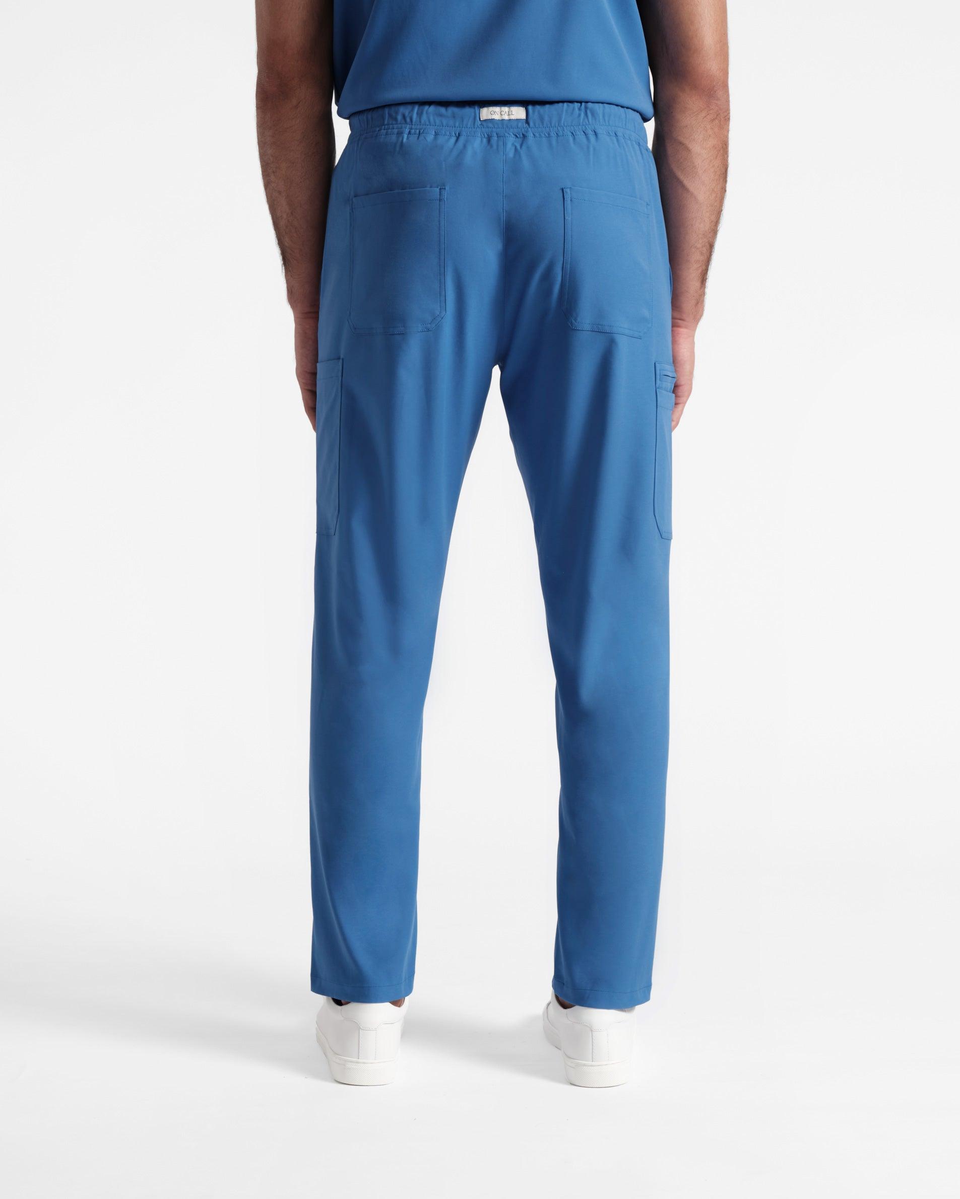 Back side view of men's cargo scrub pant in venous blue