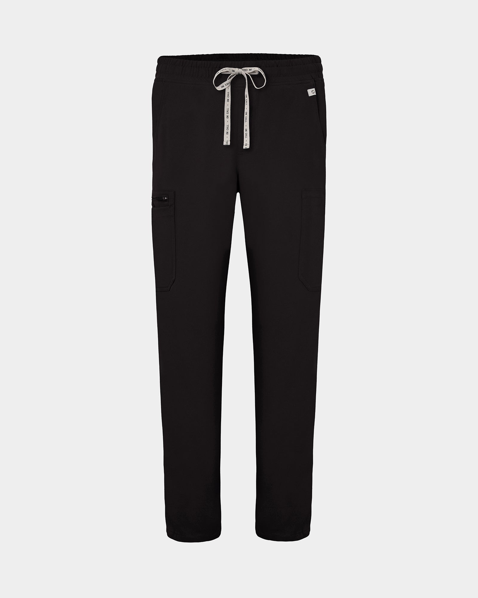 Black scrub pants with cargo pockets, a logo drawstring tie, set against a solid light grey background.