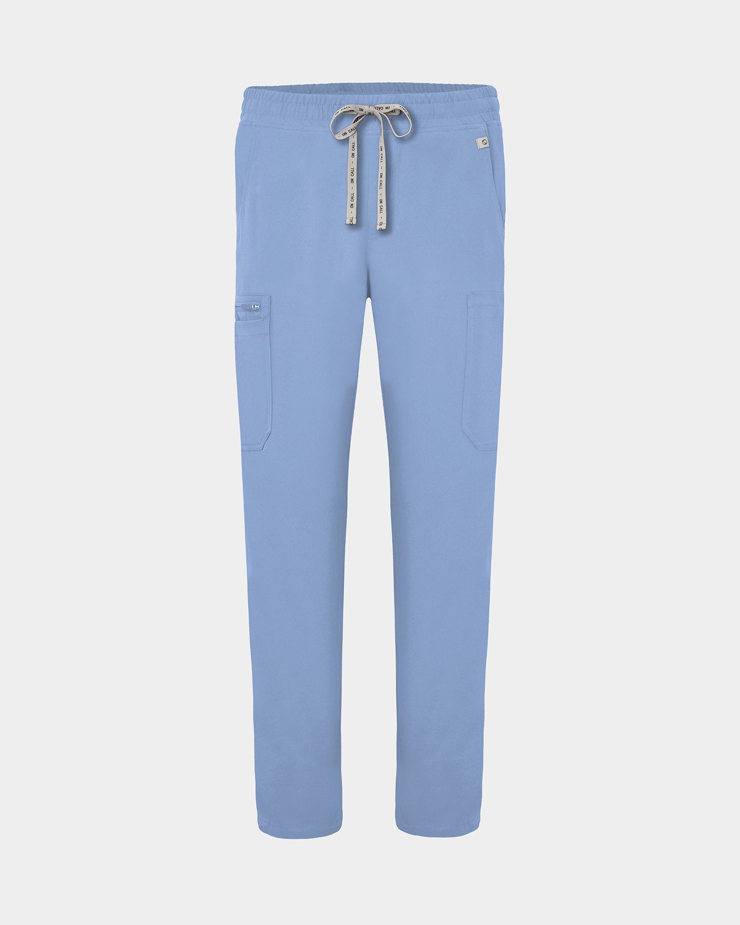 Light blue scrub pants with cargo pockets, a logo drawstring tie, set against a solid light grey background.