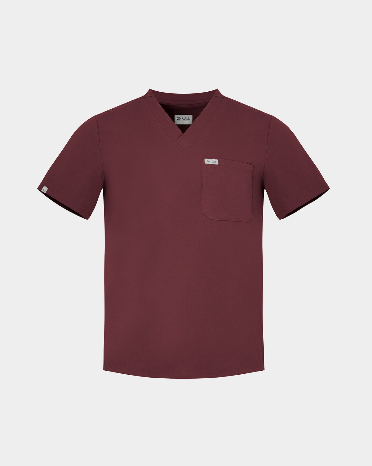 Heme Red v-neck scrub top with a chest pocket and a white logo label.