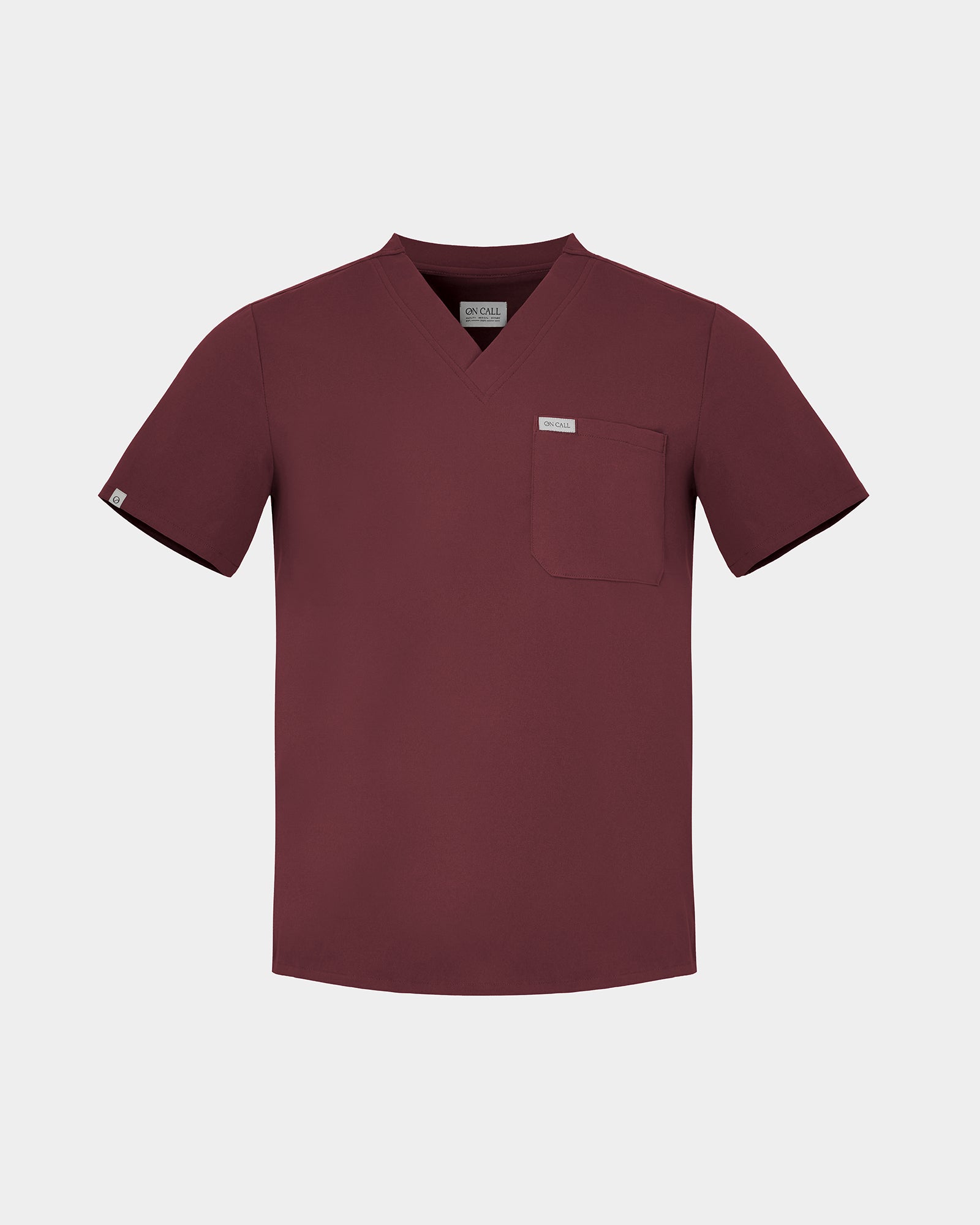 Heme Red v-neck scrub top with a chest pocket and a white logo label.