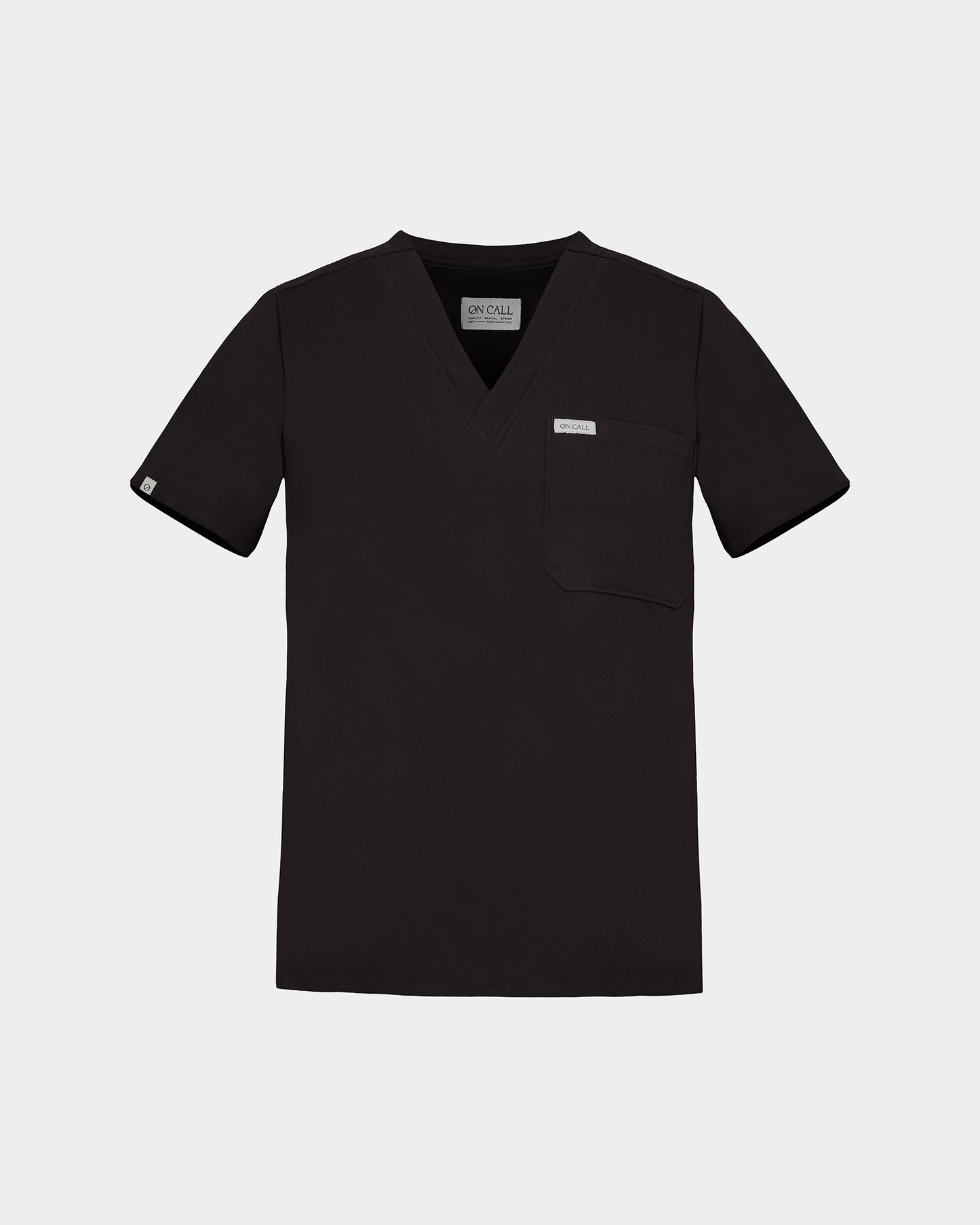 A black short-sleeve V-neck scrub top with a chest pocket, shown flat against a light gray background.