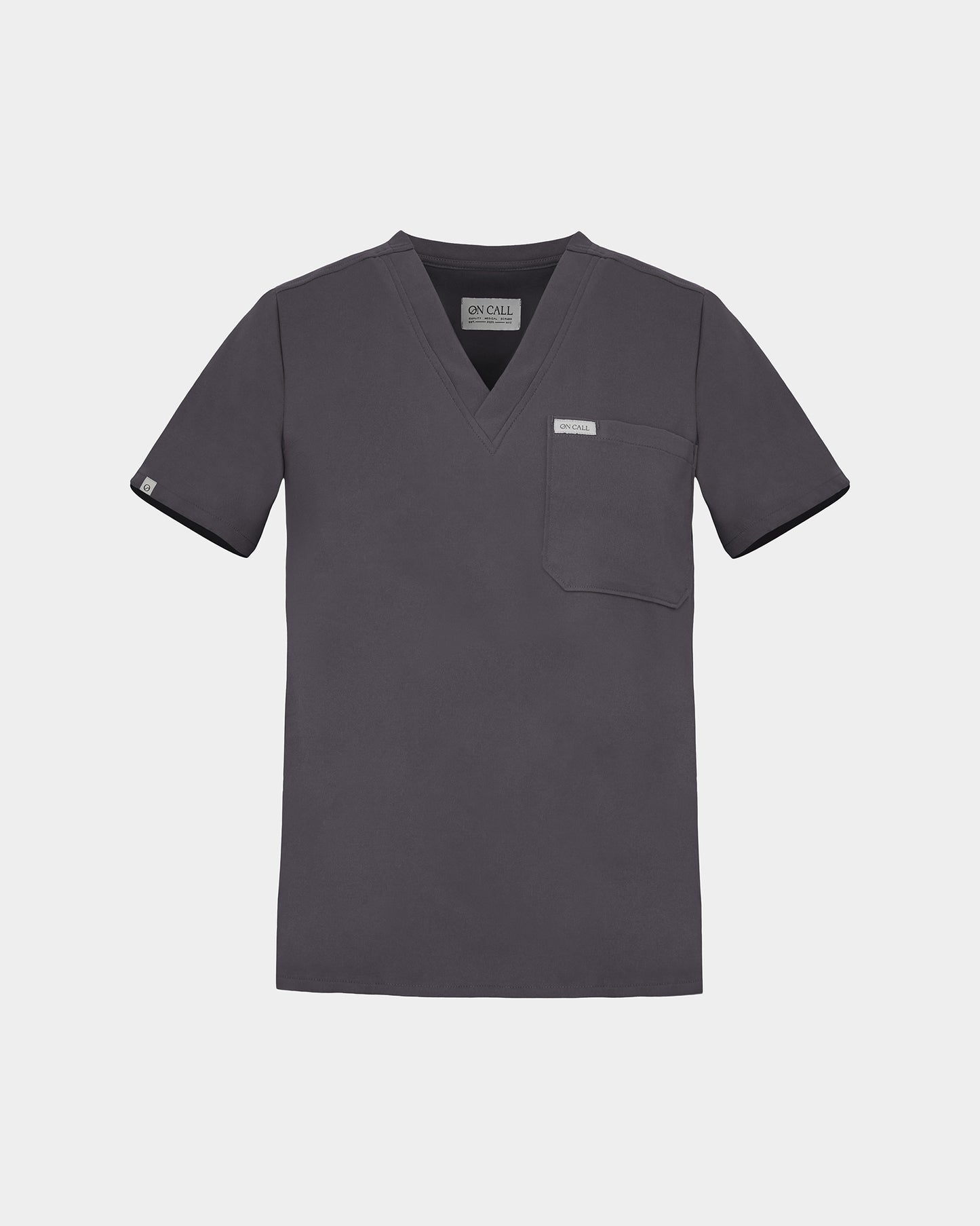 A dark grey scrub top with a V-neck, short sleeves, and a chest pocket, shown flat on a light gray background.