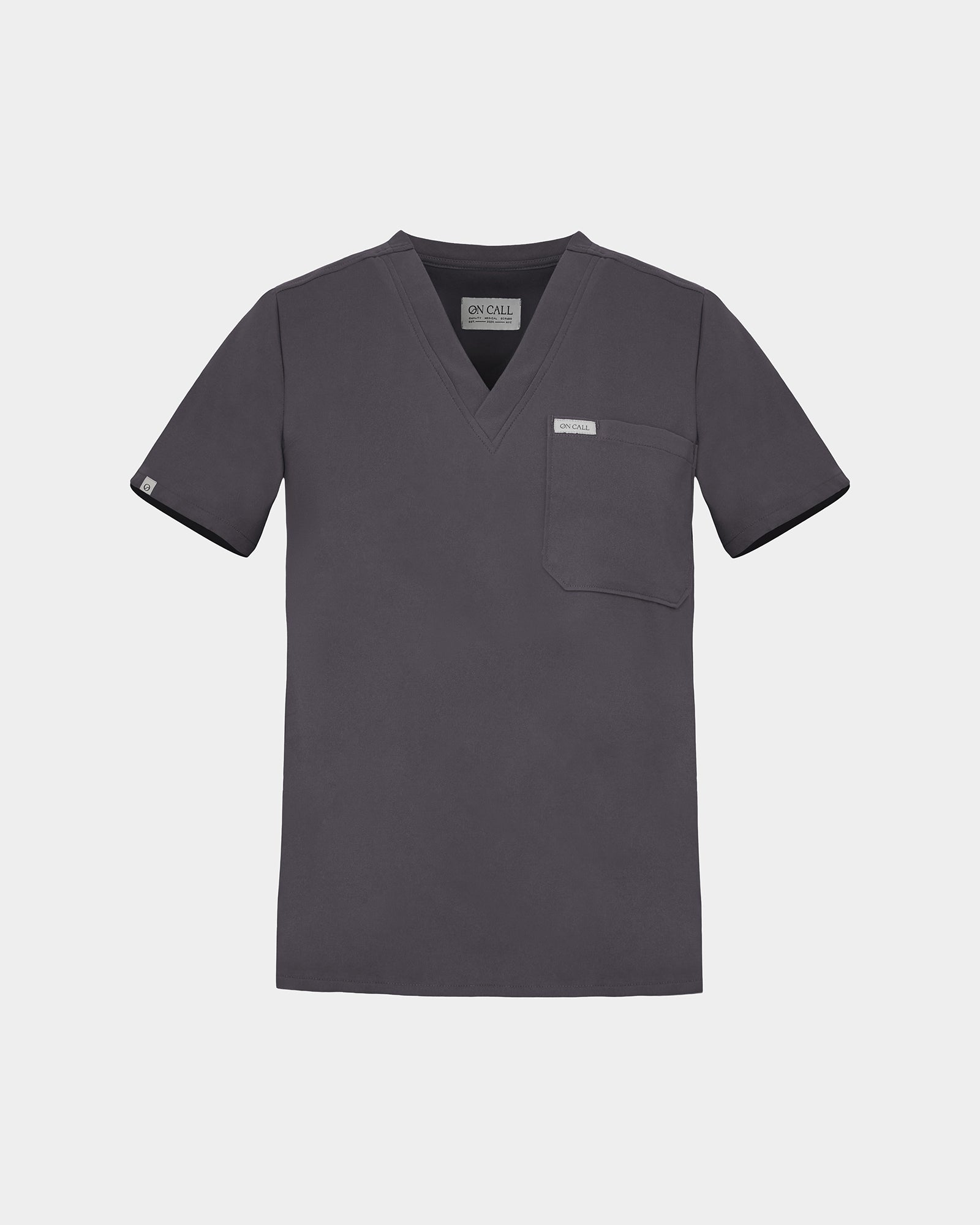 A dark grey scrub top with a V-neck, short sleeves, and a chest pocket, shown flat on a light gray background.