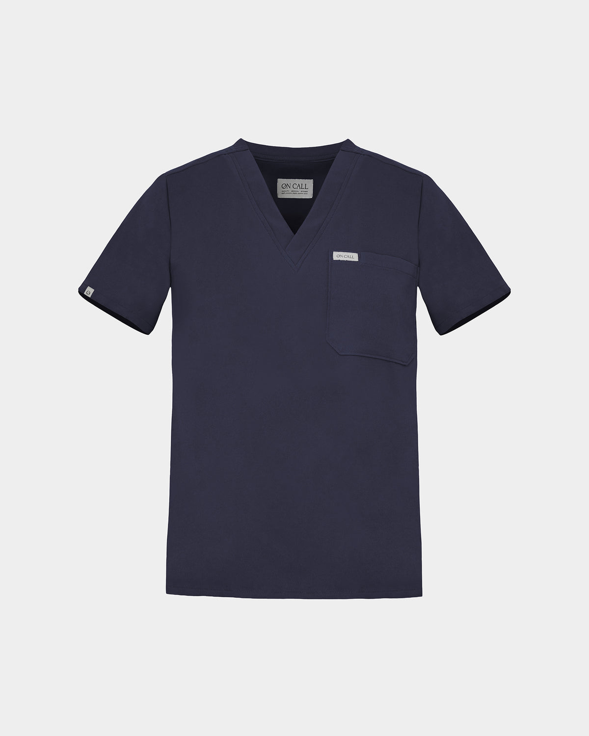 Navy v-neck scrub shirt with a chest pocket featuring a logo label on the pocket and on the sleeve.