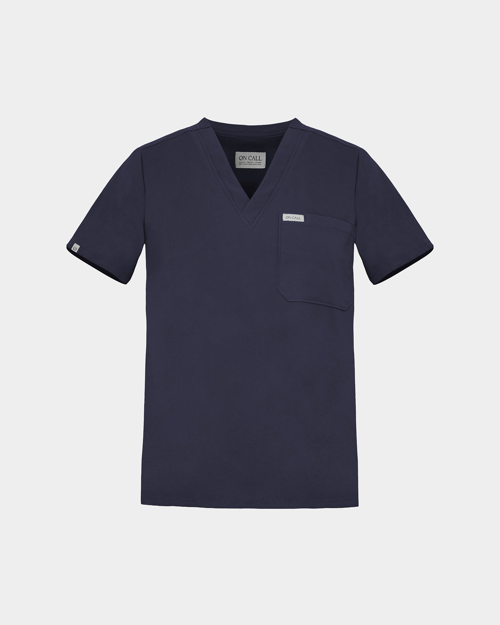 Navy v-neck scrub shirt with a chest pocket featuring a logo label on the pocket and on the sleeve.