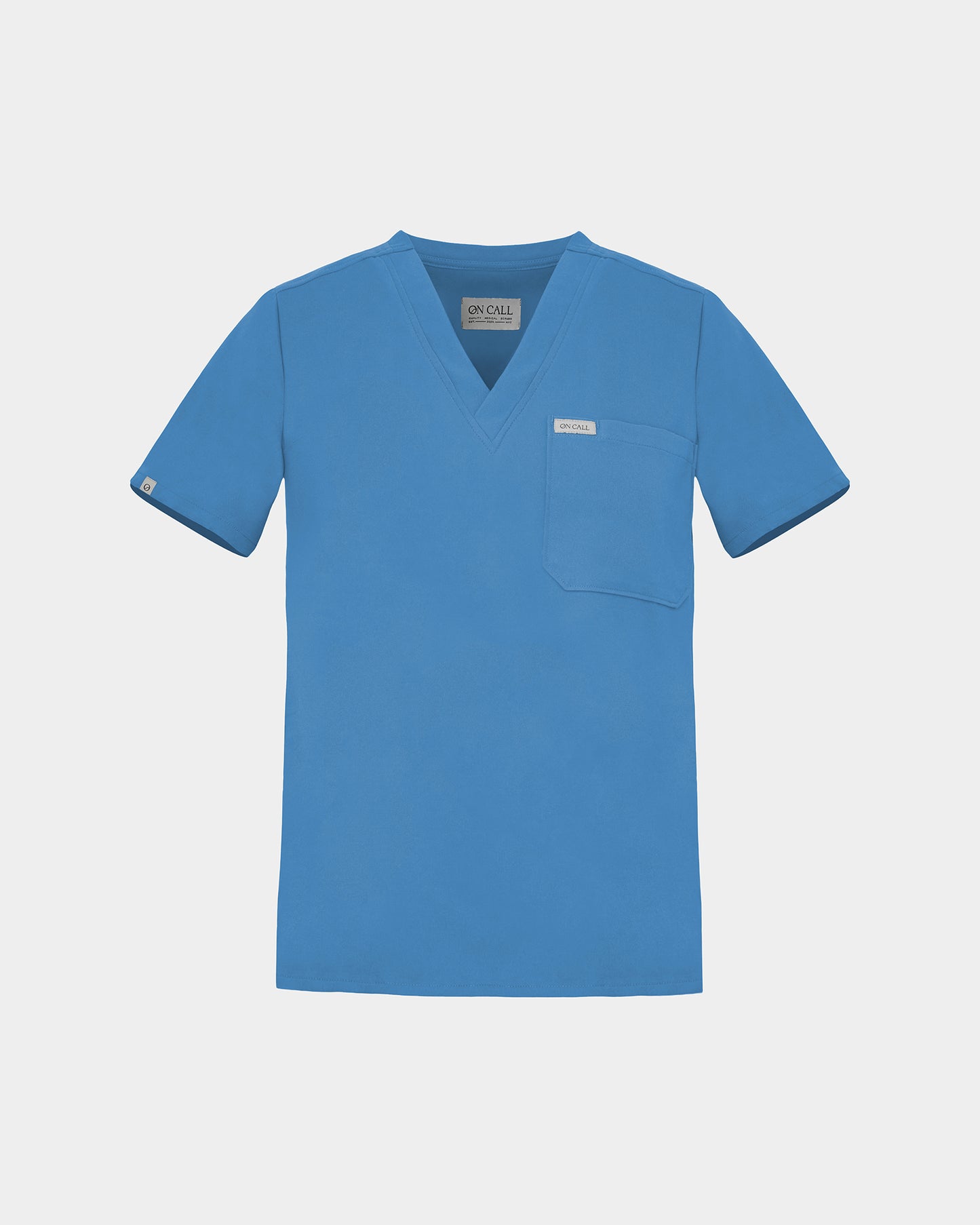 V-neck scrub shirt in a bright blue color, featuring a chest pocket with a logo label.
