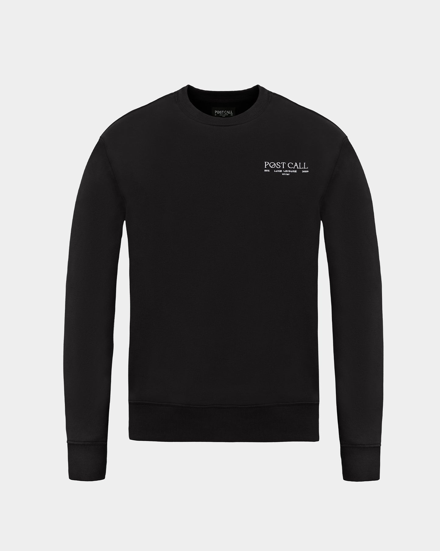 A black crewneck sweatshirt with a small white 'POST CALL' logo embroidered on the left chest, displayed on a clean light gray background.