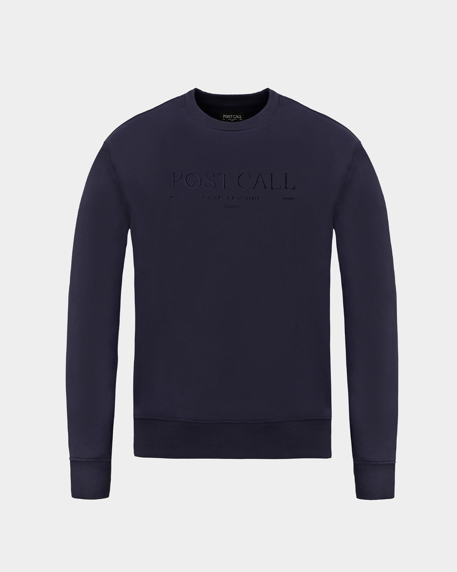 A dark navy blue crewneck sweatshirt with 'POST CALL' embroidered in tonal thread across the chest, displayed on a light gray background.