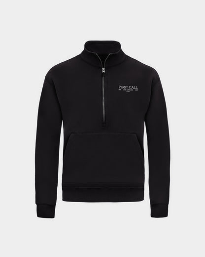 A black long-sleeve quarter-zip pullover sweatshirt with a small white 'POST CALL' logo on the left chest and kangaroo pocket displayed on a clean light gray background.