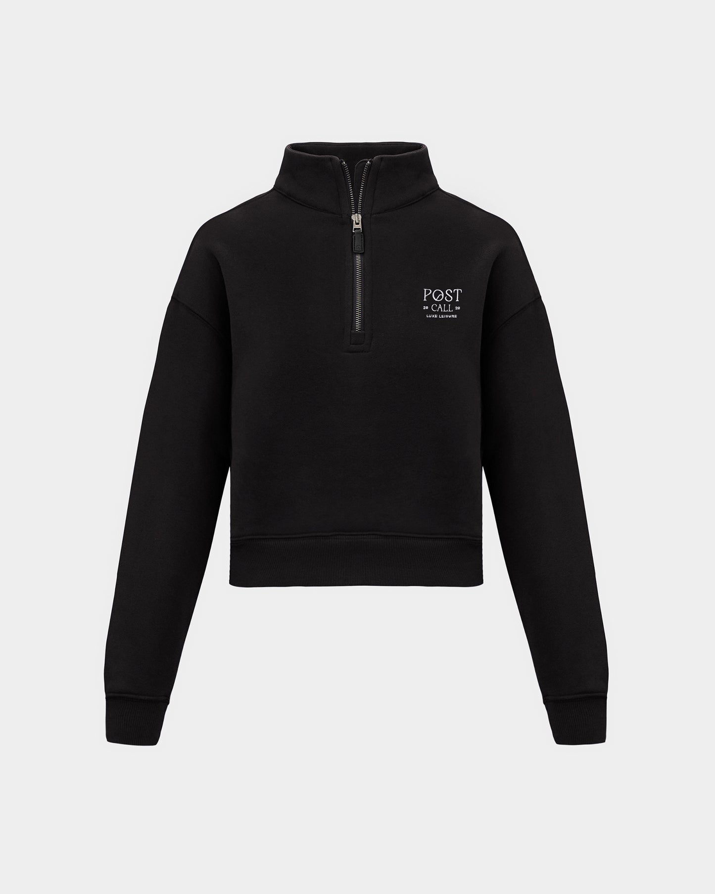 A black half-zip sweatshirt with a small white 'POST CALL' logo on the left chest, displayed on a clean light gray background.