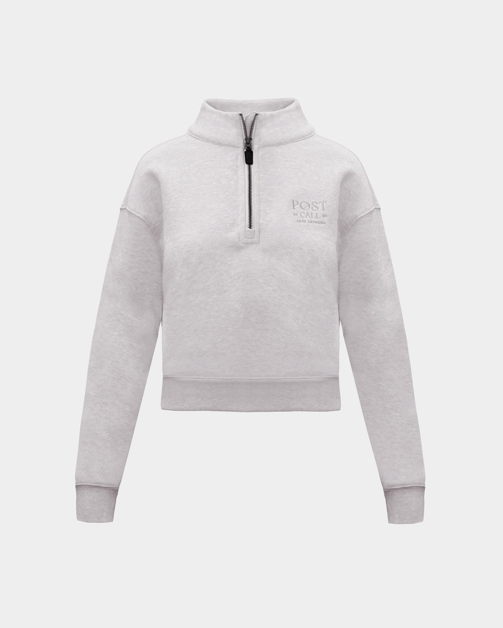 A heather grey long-sleeve quarter-zip pullover sweatshirt with a small tonal 'POST CALL' logo on the left chest,  displayed on a clean light gray background.