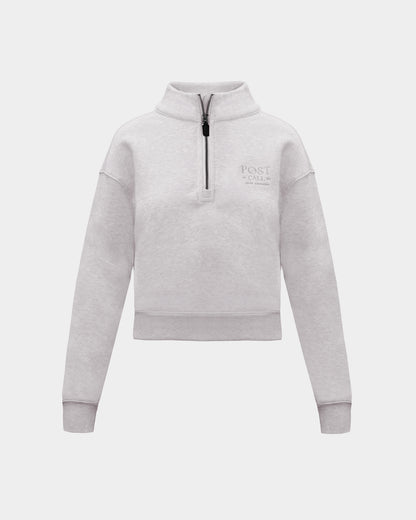 A heather grey long-sleeve quarter-zip pullover sweatshirt with a small tonal 'POST CALL' logo on the left chest,  displayed on a clean light gray background.