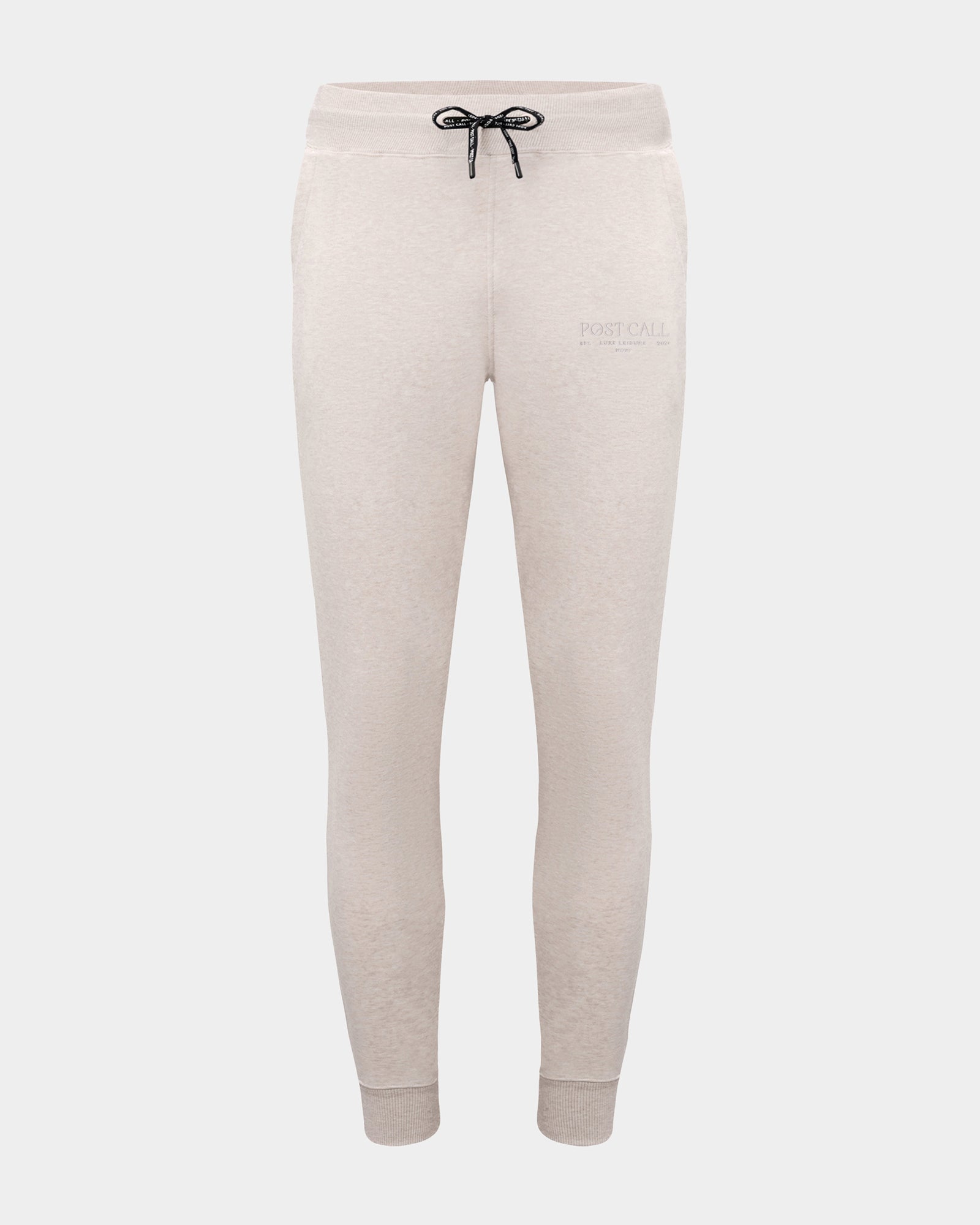 Heather beige jogger lounge pants with ankle cuffs, a logo drawstring, and a tonal embroidered 'POST CALL' logo on the left thigh.