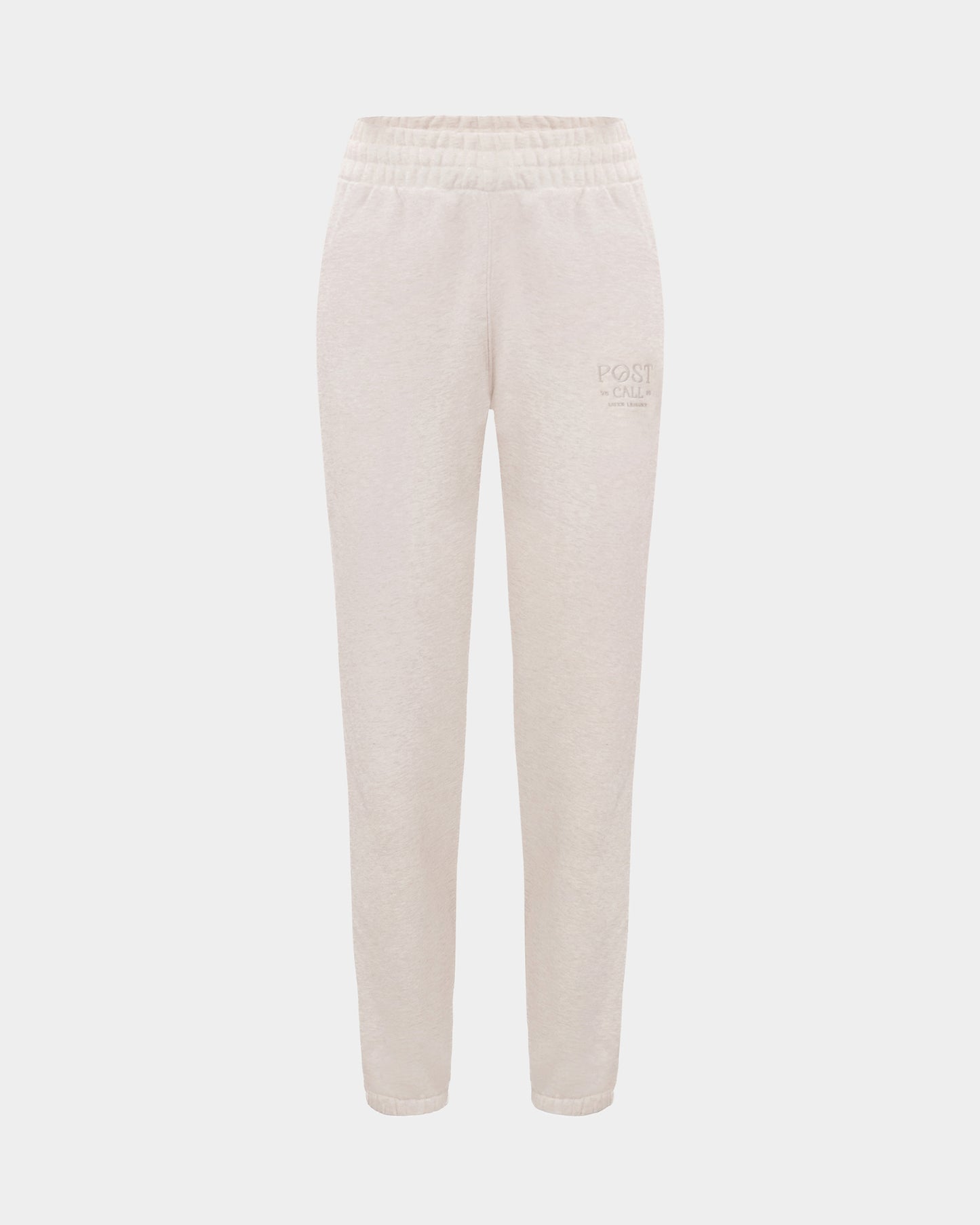 Heather beige lounge pants with a thick elasticated waistband, hidden drawstring, elasticated ankle cuffs, and tonal logo embroidery on the left thigh.