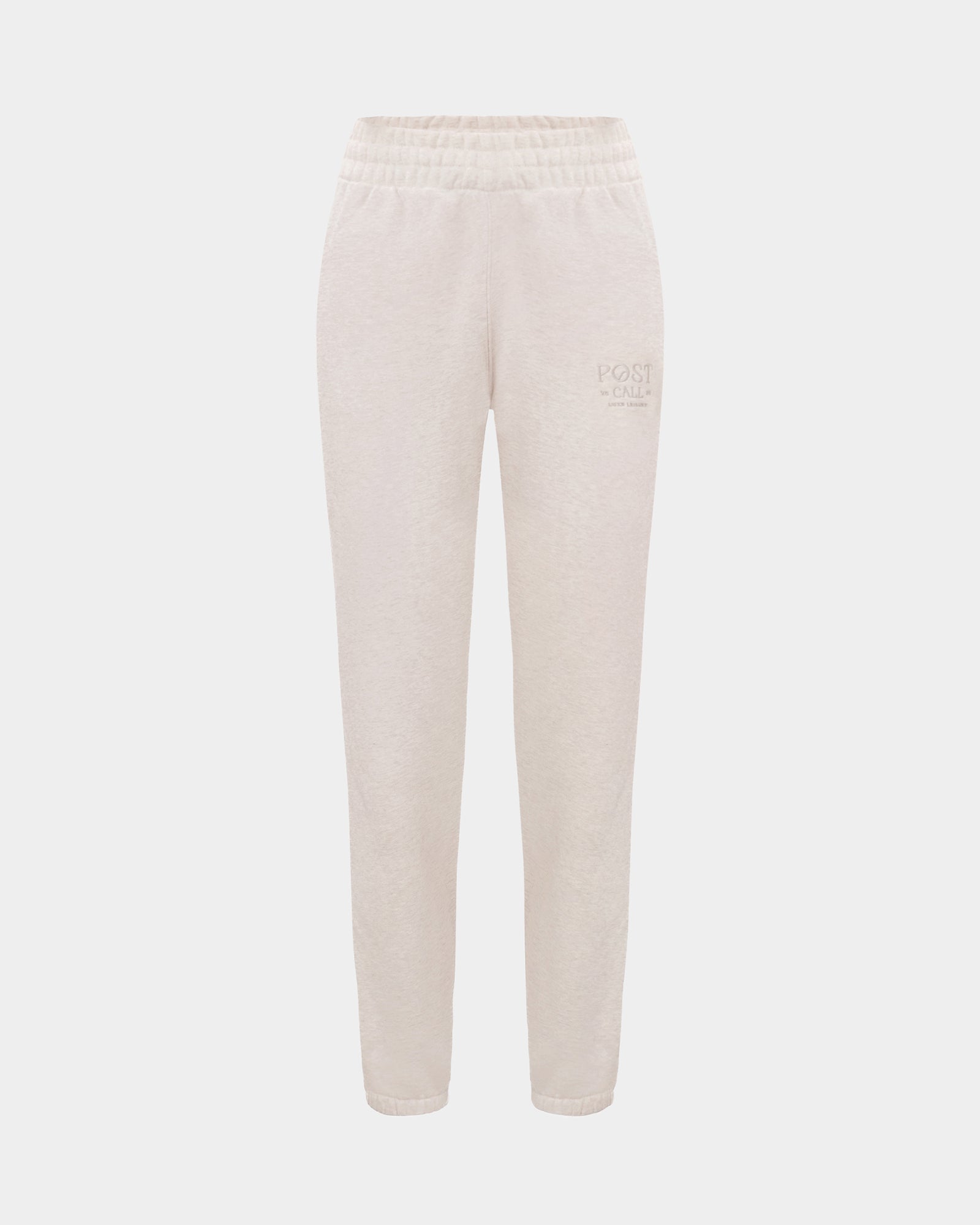 Heather beige lounge pants with a thick elasticated waistband, hidden drawstring, elasticated ankle cuffs, and tonal logo embroidery on the left thigh.
