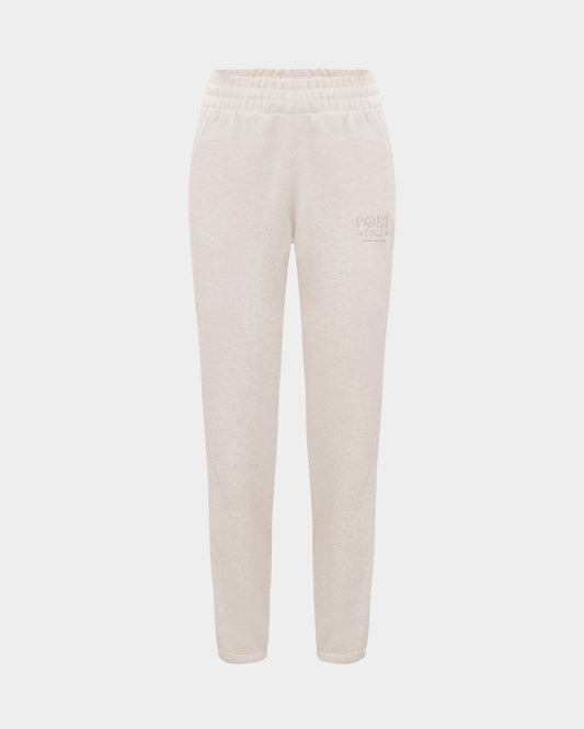 Heather beige lounge pants with a thick elasticated waistband, hidden drawstring, elasticated ankle cuffs, and tonal logo embroidery on the left thigh.