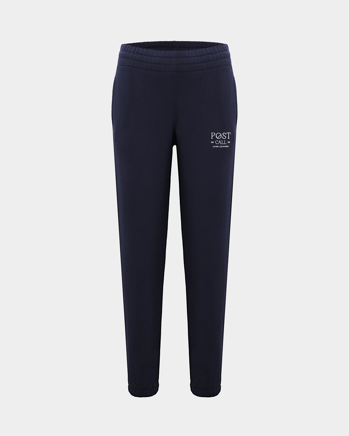 A pair of navy blue sweatpants with a white 'POST CALL' logo embroidered on the left thigh, shown against a light gray background.