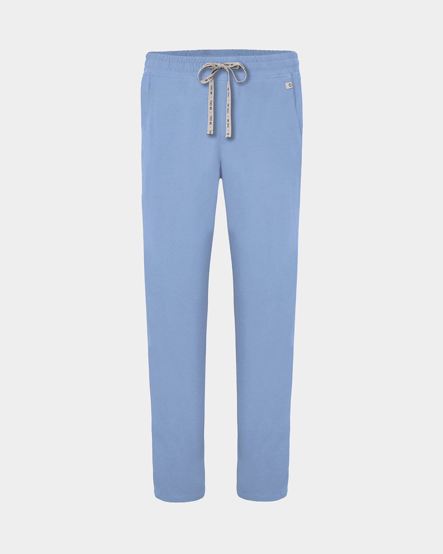 Light blue straight leg scrub pants with a white logo drawstring and a small white logo on the left hip, shown against a light gray background.