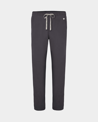 Dark grey straight leg scrub pants with a white logo drawstring and a small white logo on the left hip, shown against a light gray background.