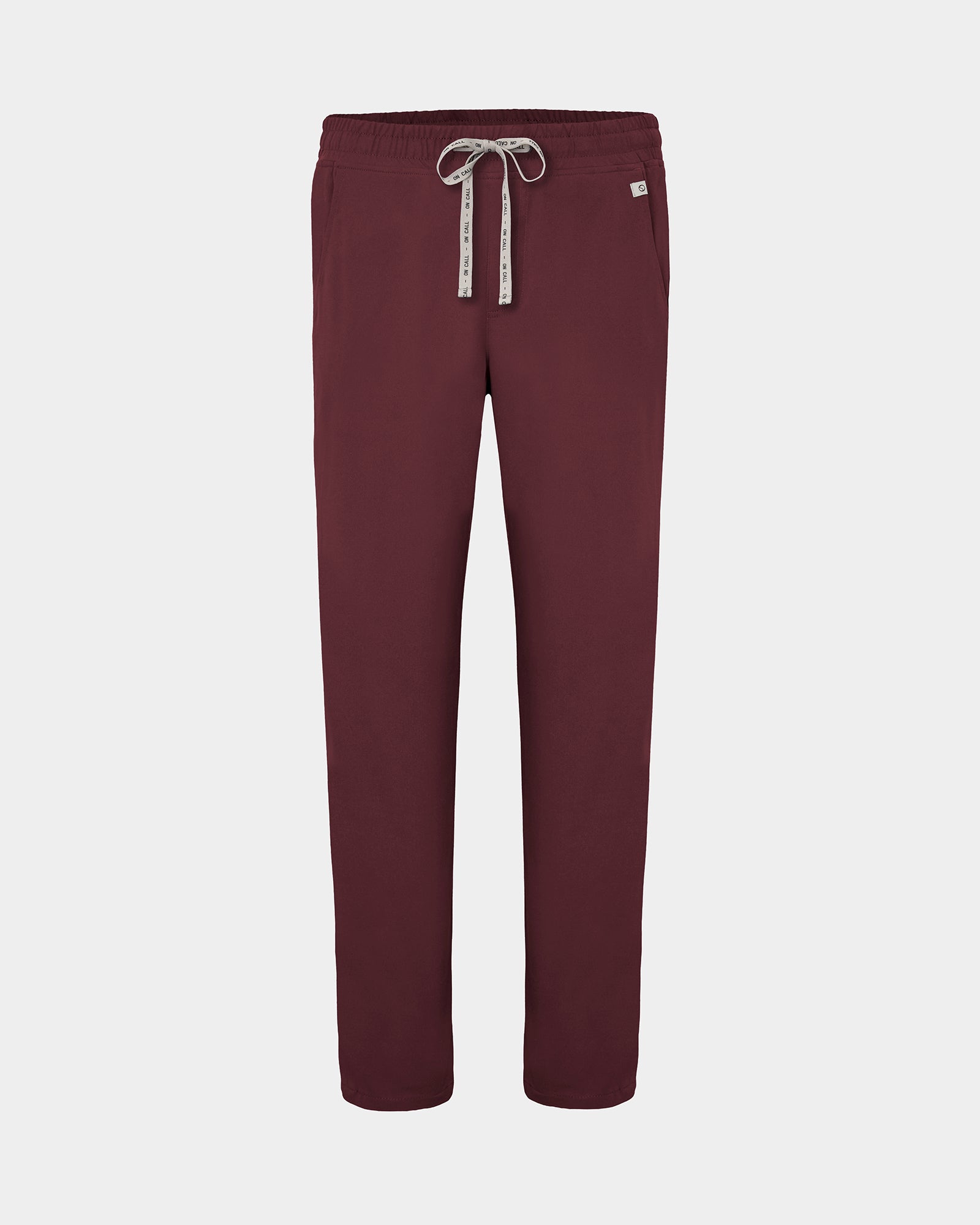 A pair of heme red straight leg scrub pants with a logo drawstring, displayed against a light gray background.