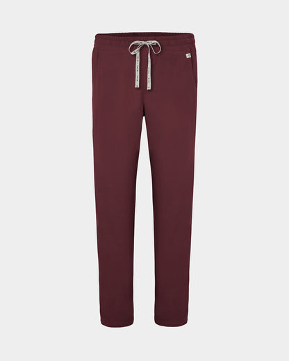 A pair of heme red straight leg scrub pants with a logo drawstring, displayed against a light gray background.