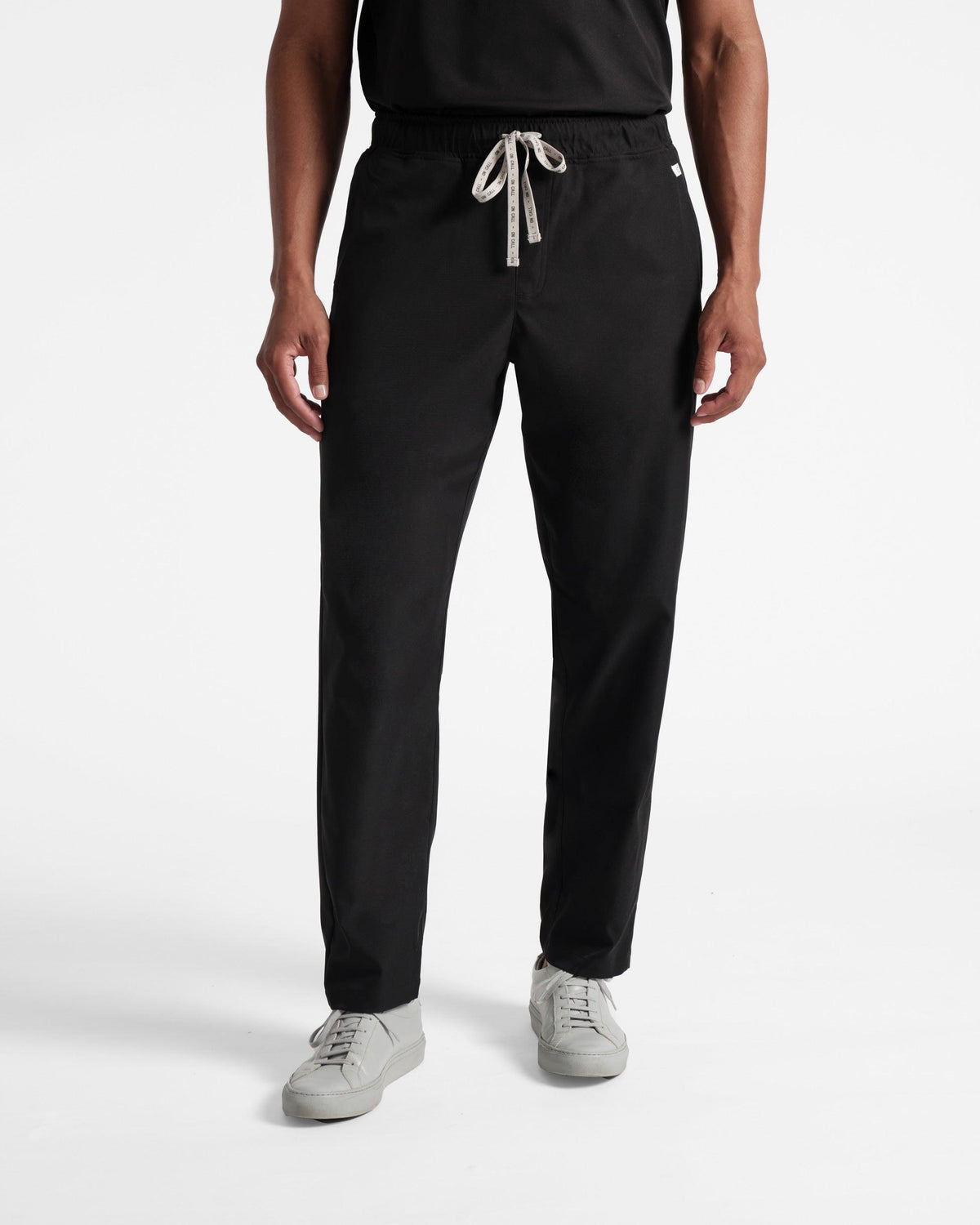 Black straight leg scrub pant with branded On Call waistband tie.