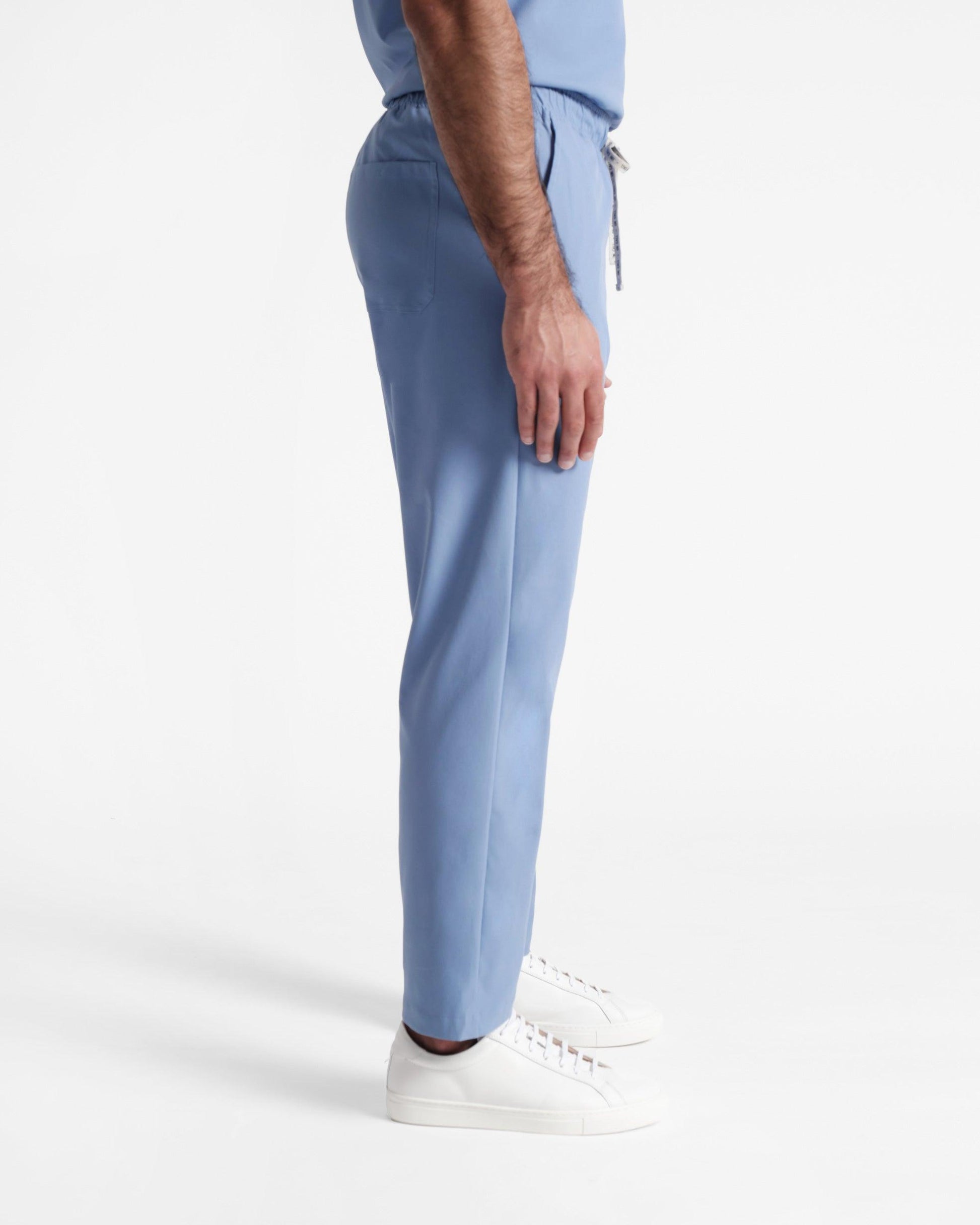 Side view of men's straight leg scrub pant in ciel blue