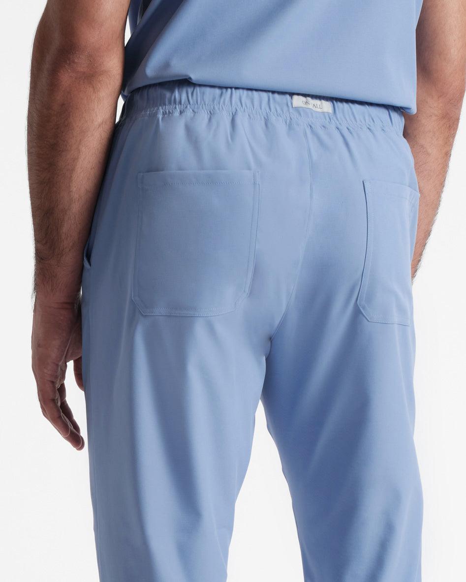 Back side view of men's straight leg scrub pant in ciel blue