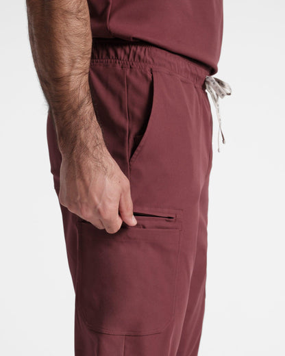 Close up of side pockets on men's jogger cargo scrub in heme red