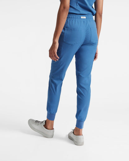 Back side view of women's jogger cargo scrub in venous blue