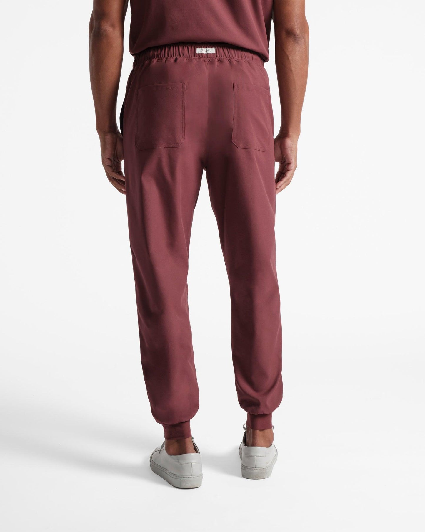 Back side view of men's jogger scrub pant in heme red