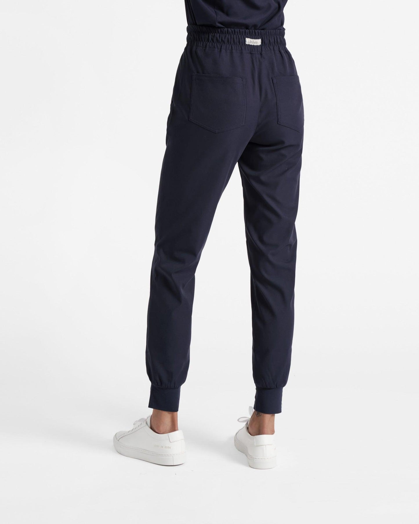 Back side view of women's navy jogger scrub pant