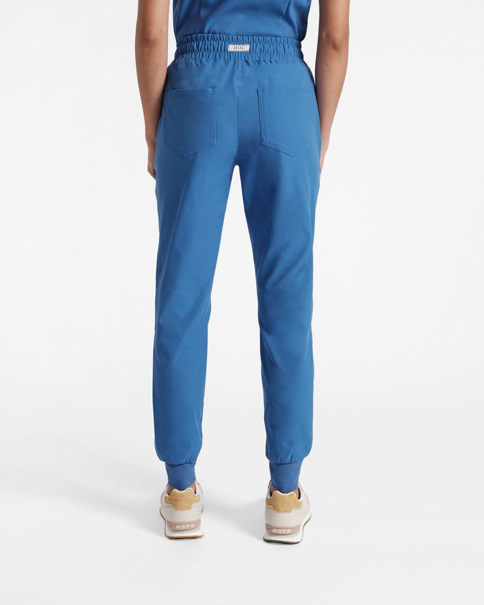 Back side view of woman in bright blue jogger scrubs with two back pockets.