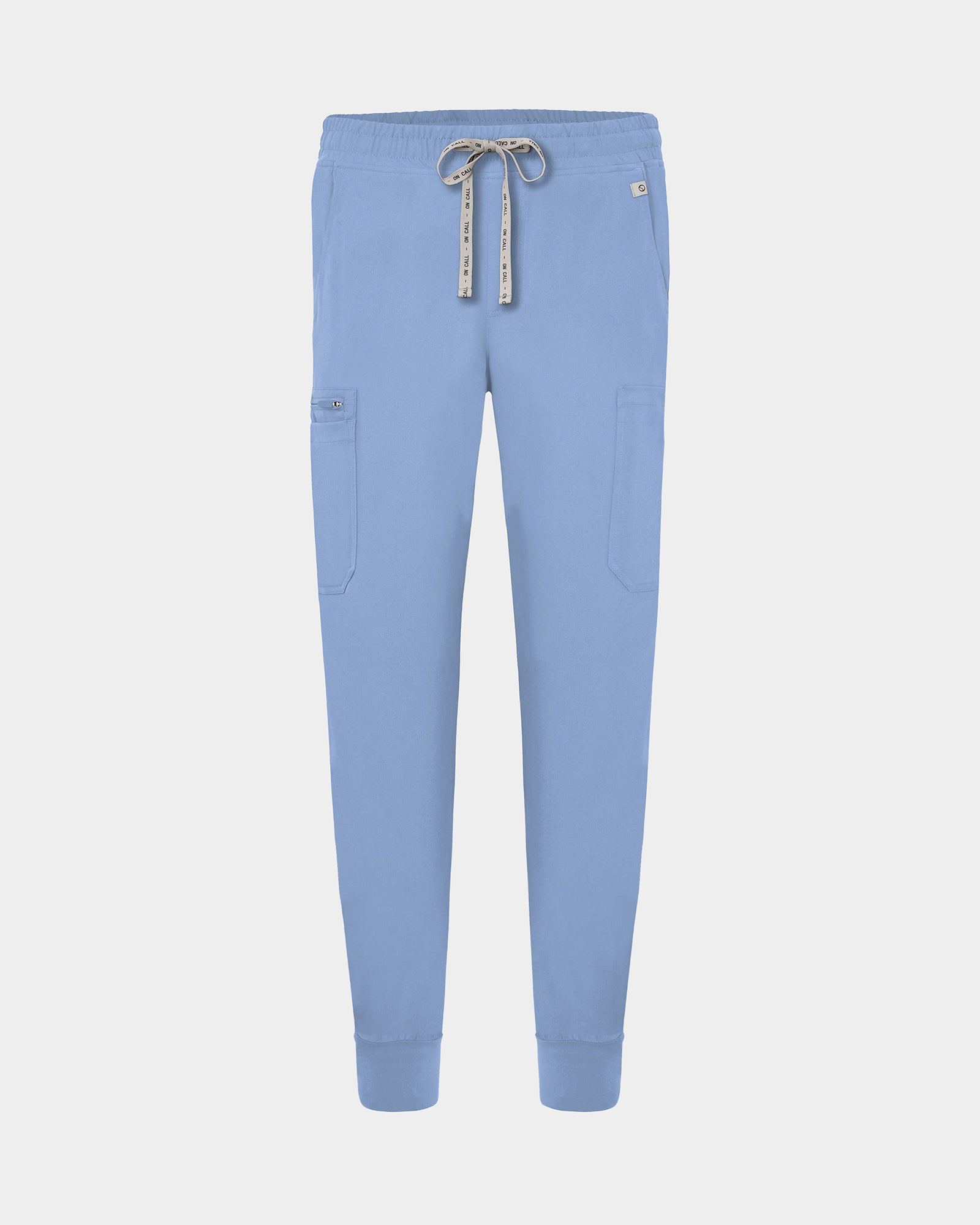 Light blue cargo jogger scrub pants with a logo drawstring, small logo label on the hip pocket, and ankle cuffs.