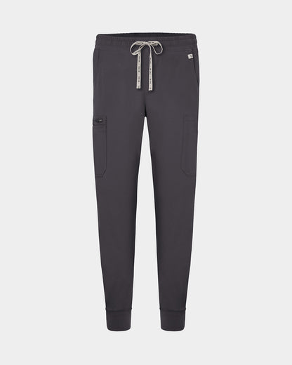 Dark grey jogger-style scrub pants with an elastic waistband, white logo drawstring, and side cargo pocket, shown on a light gray background.