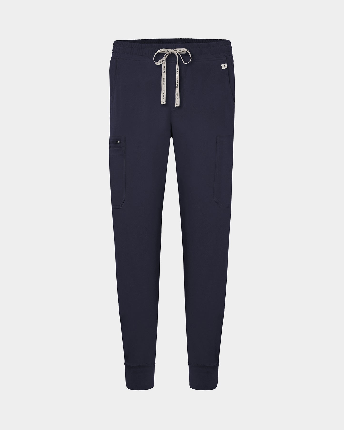 Navy cargo jogger scrub pants with a logo drawstring, small logo label on the hip pocket, and ankle cuffs.