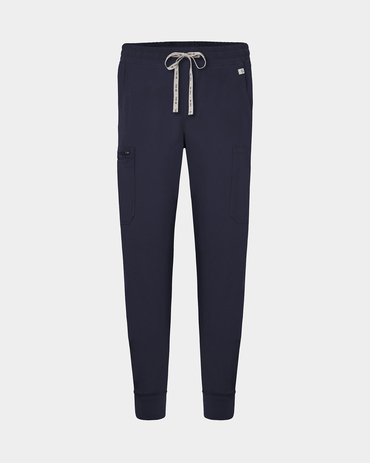 Navy cargo jogger scrub pants with a logo drawstring, small logo label on the hip pocket, and ankle cuffs.