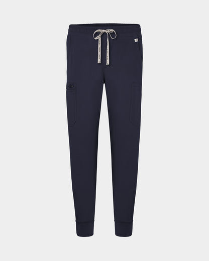 Navy cargo jogger scrub pants with a logo drawstring, small logo label on the hip pocket, and ankle cuffs.