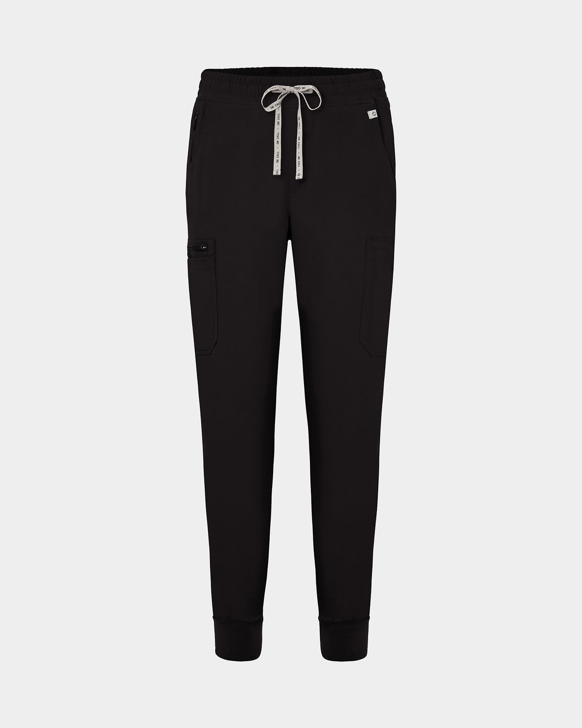 Black jogger-style scrub pants with a white drawstring, cargo pockets, and a small white logo on the upper right hip, shown against a light gray background.