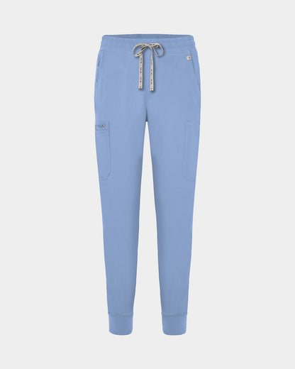 Light blue jogger-style scrub pants with a white drawstring, cargo pockets, and a small white logo on the upper right hip, shown against a light gray background.
