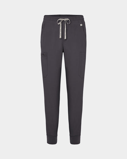 Dark grey jogger-style scrub pants with a white drawstring, cargo pockets, and a small white logo on the upper right hip, shown against a light gray background.