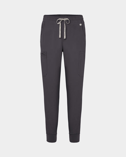 Dark grey jogger-style scrub pants with a white drawstring, cargo pockets, and a small white logo on the upper right hip, shown against a light gray background.