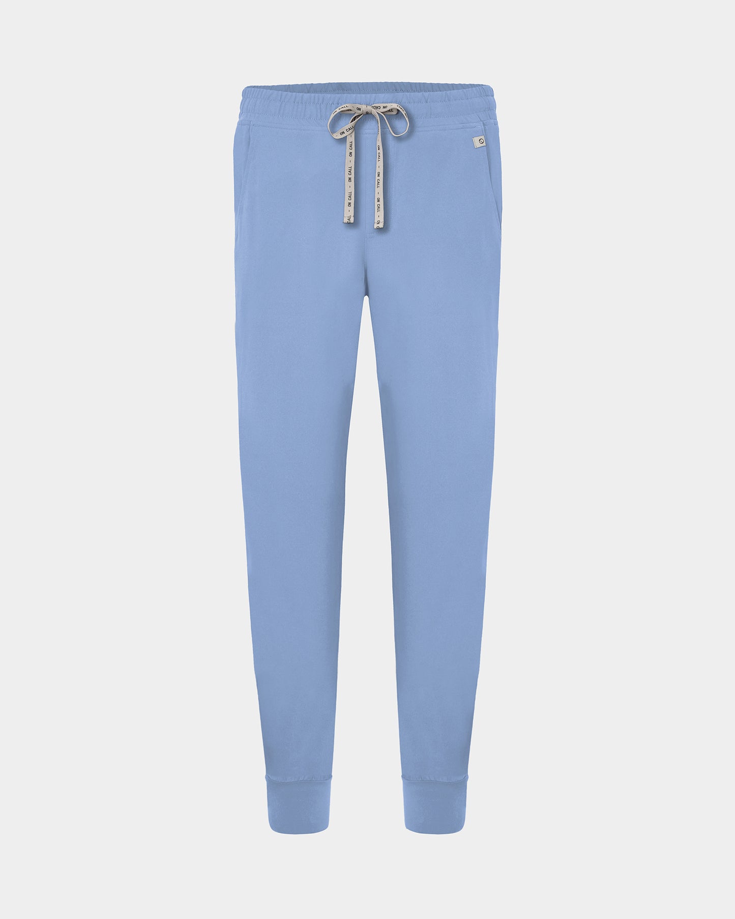 Light blue cargo jogger scrub pants with a logo drawstring, small logo label on the hip pocket, and ankle cuffs.